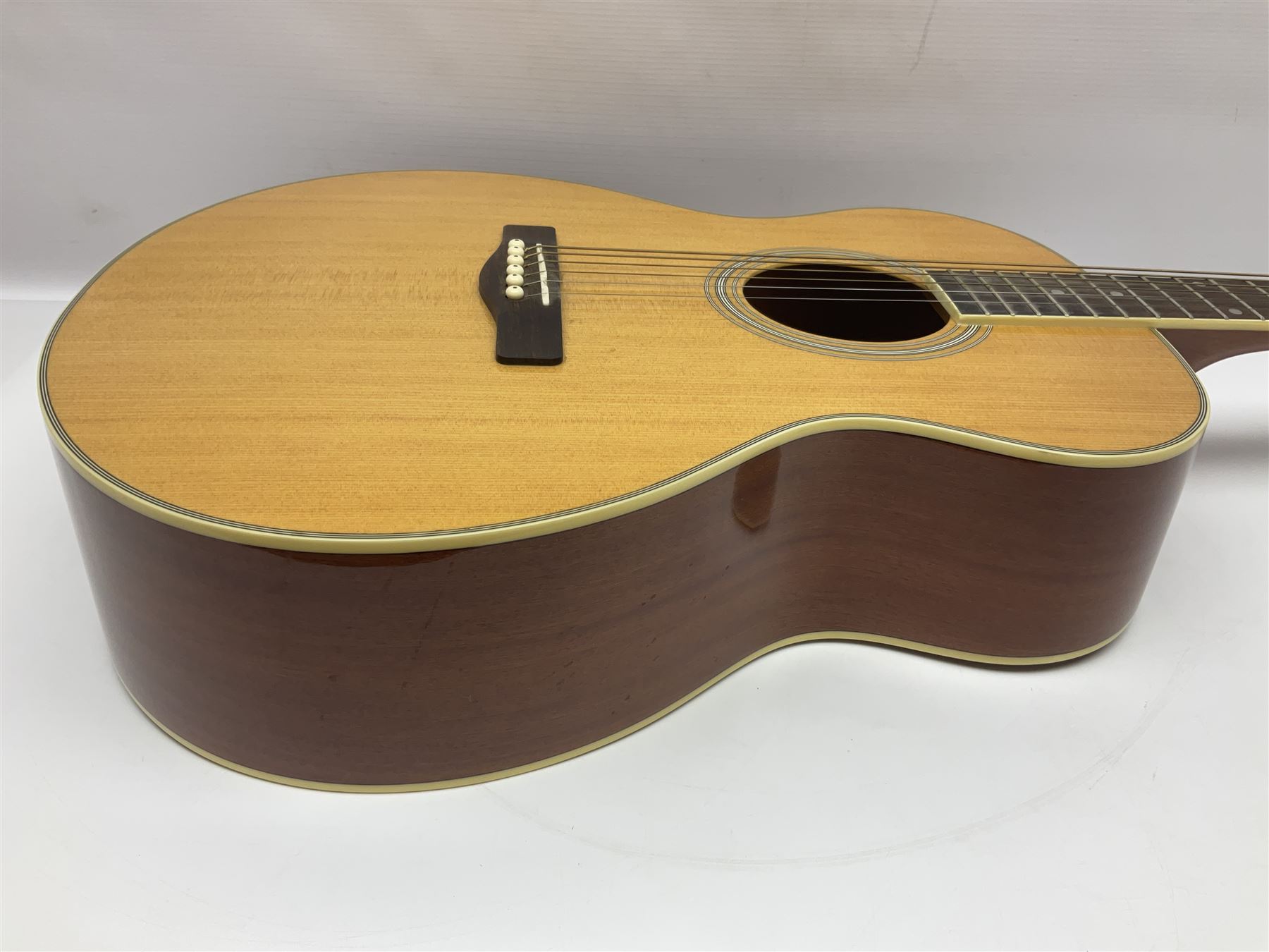 Woodstock model no.WHW41J203 acoustic guitar with mahogany back and sides and spruce top, serial no.2835 L102.5cm; in soft carrying case