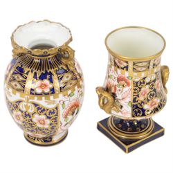 Four Royal  Crown Derby vases in imari patterns, including baluster vase with fluted rim in pattern no 6299, twin handled vase on a square base etc 
