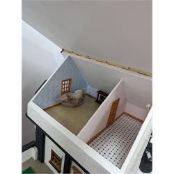 1:24 scale four-storey tudor-style dolls house, with black and white exterior, balcony garden, glazed panelled windows and wooden shingle roof, with decorated interior and wired fireplaces and lighting, H65cm, W58cm, D31cm, 