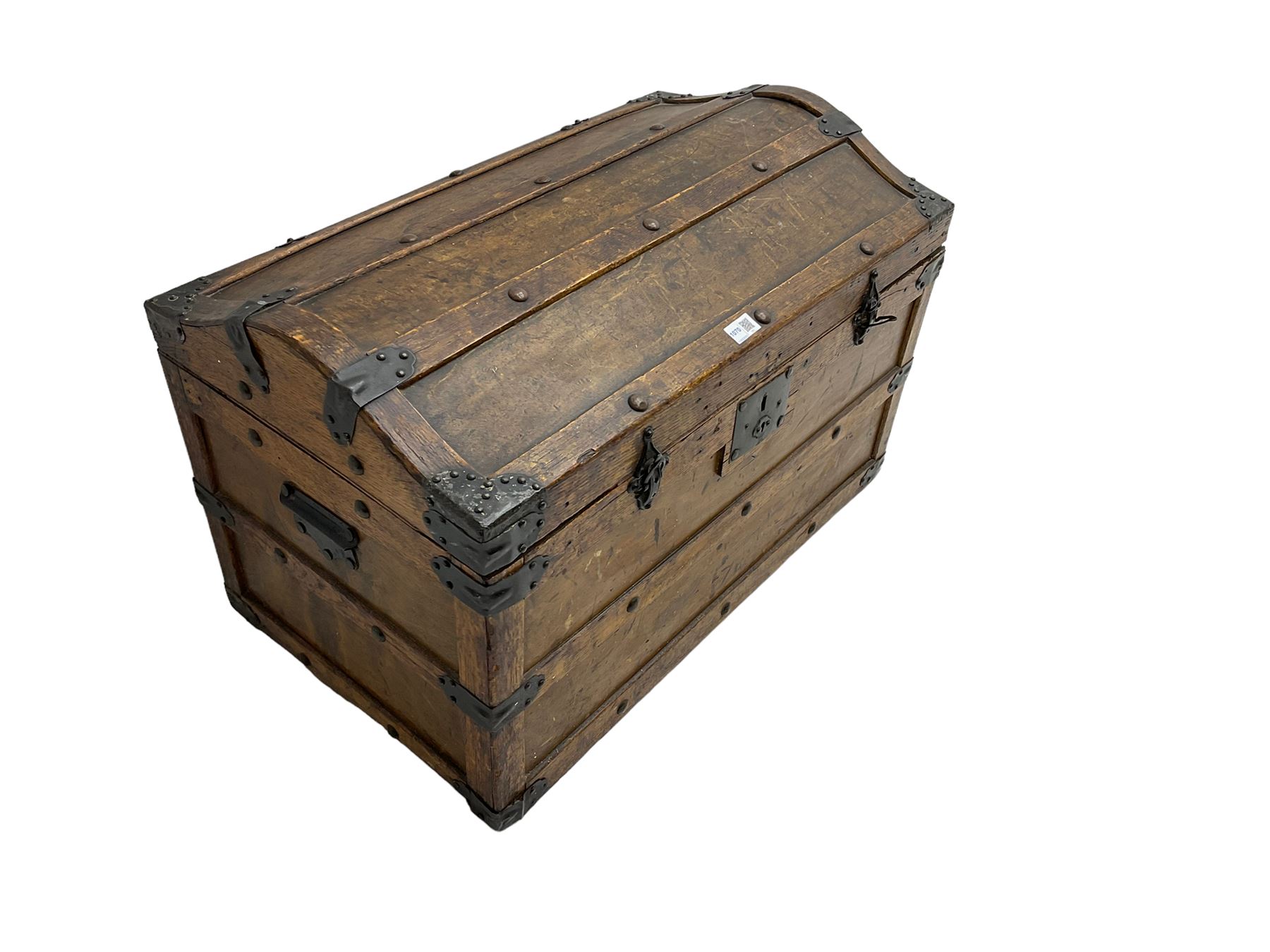 Late 19th to early 20th century oak framed travelling trunk, dome top with iron fittings and panelled sides and top, interior labelled 'The Anchor Patent Waterproof Travelling Trunk - 1902'
