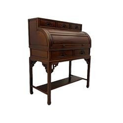 Hardwood cylinder desk, three drawers raised over curved lid, fitted interior with slide, the supports joined by undertier with fret work brackets 