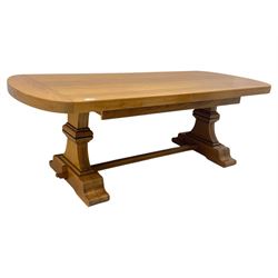 Oak extending dining table with elegant scrolled shaped double pedestal base and scrolled feet; together with a set of eight ladder back chairs with rush seats ((9) table closed 228x95x79cm chairs 106x38x44cm 
