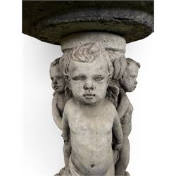 Cast stone cherub bird bath, circular removable top raised on three cherubs with ornate detailing