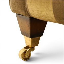 Alstons - 'Ixworth' three seat sofa, upholstered in striped fabric, with loose seat cushions and scrolled arms, front brass castors