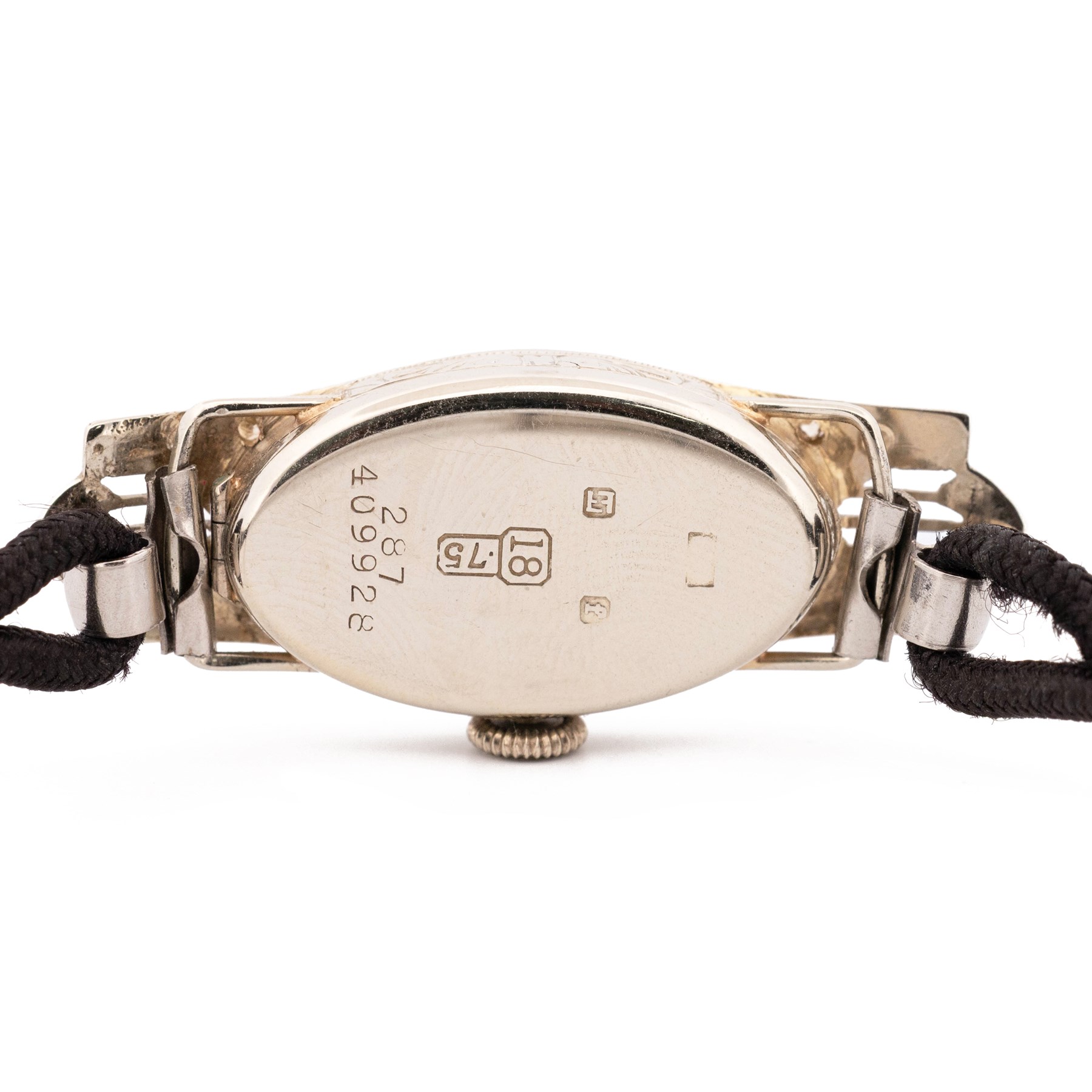 Art Deco 18ct white gold diamond ladies manual wind wind wristwatch, silvered engine turned dial with Arabic hour markers, the pierced design case milgrain set with single cut diamonds, Glasgow import mark 1928, on black cord strap, with stainless steel clasp