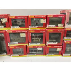Hornby 'N' gauge - eighteen Lyddle End trackside buildings including The Old Toll House, Electricity Sub Station, Teesdale bakery, Mason's Arms Pub, various shops and hairdressers, farm buildings, Clock Tower etc; all boxed; and five Lyddle End blister pack cards of trackside accessories including Lamp Huts, Tractors, War memorial etc (23)