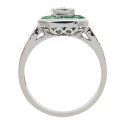 18ct white gold calibre cut emerald and round brilliant cut diamond ring, with diamond set shoulders, stamped 750