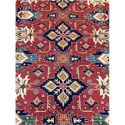 Turkish red ground rug, repeating border with geometric field