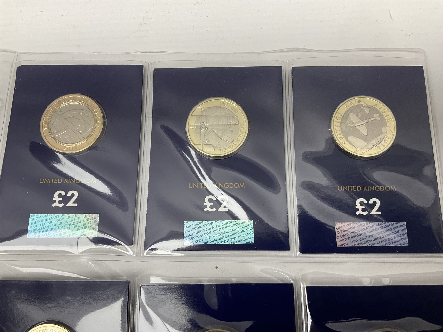 Mostly United Kingdom Queen Elizabeth II commemorative two pound  coins, including 2017 'Jane Austen', 2018 'Sea King', 2018 'Vulcan' etc face value of UK coins approximately 98 GBP