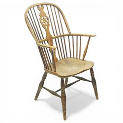 Set of two late 19th century elm and beech Windsor armchairs, each with hoop backs and turned spindles, shaped central splats, solid seats and turned supports united by H-stretchers