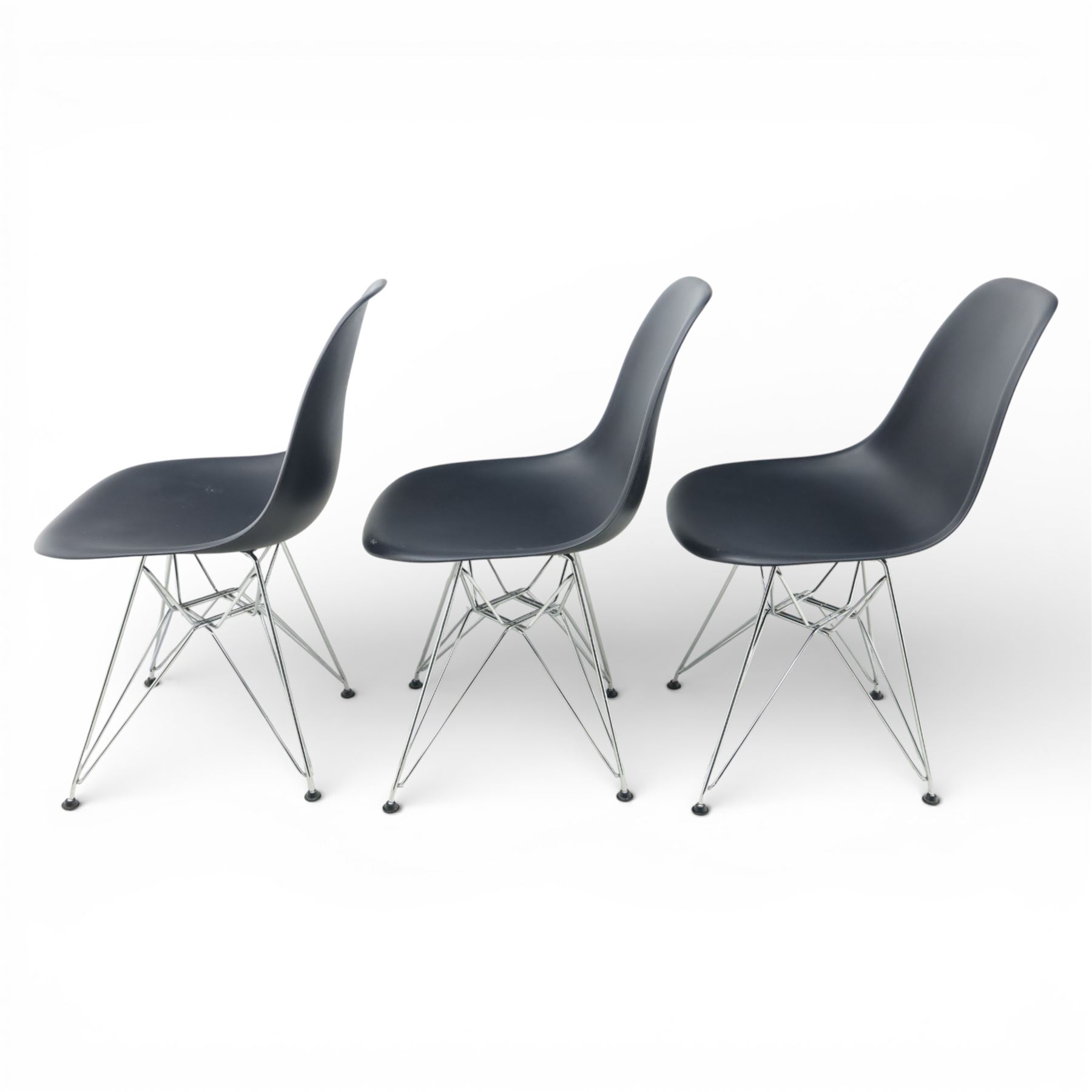 Vitra - set of six DSR side chairs designed by Charles and Ray Eames, moulded black plastic seats, raised on chromed wire Eiffel bases with plastic foot glides