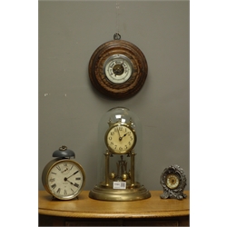  Late 20th century anniversary torsion clock under glass dome, Art Nouveau style clock, 20th century brass drum alarm clock and a 20th century aneroid barometer mounted in oak  