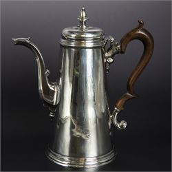 George II provincial silver coffee pot, of tapering cylindrical form, with wooden scroll capped handle, hinged cover with bell finial, and engraved crest to body, hallmarked John Webber of Plymouth, Exeter 1759, H21cm
