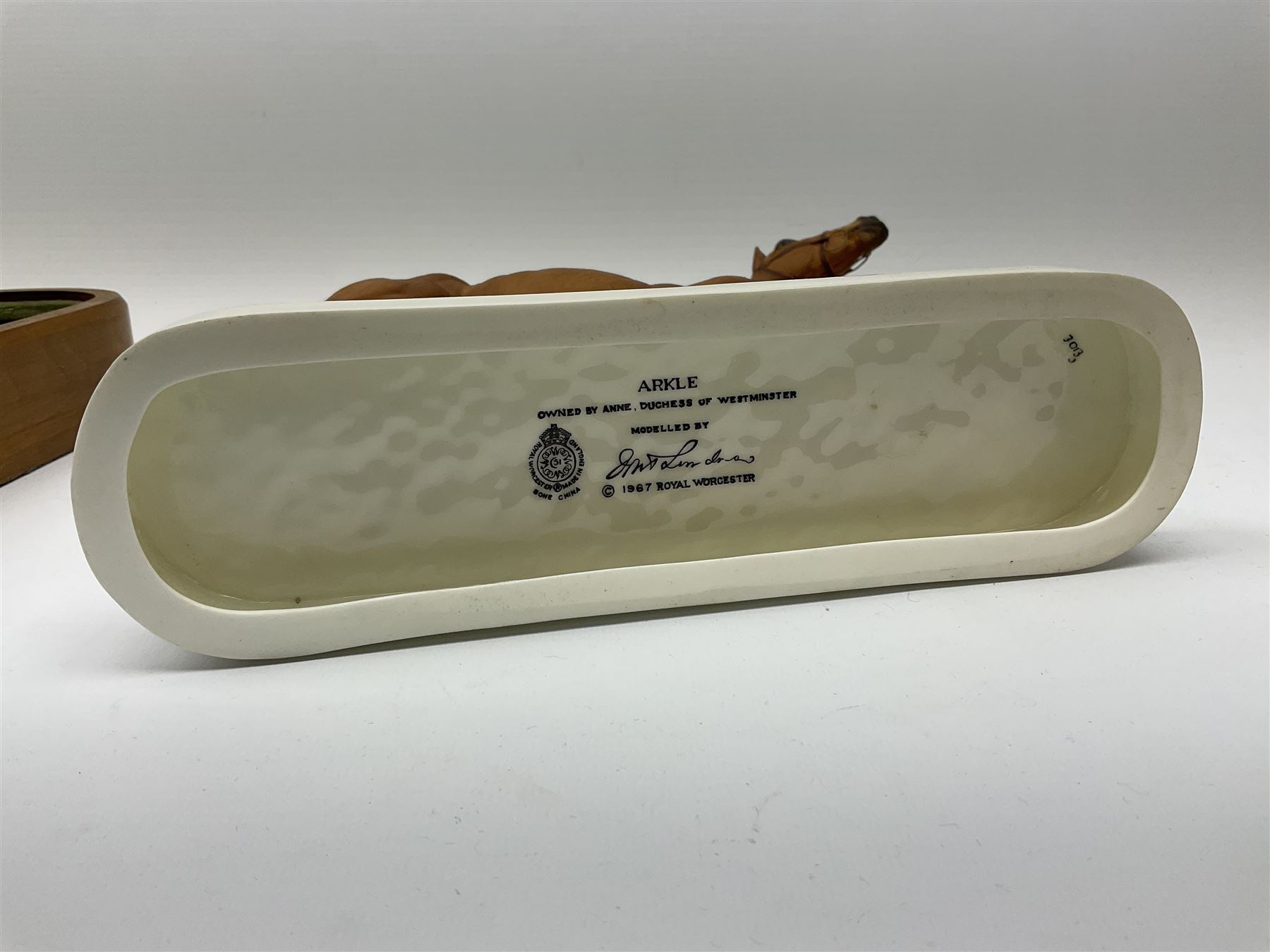 A Royal Worcester limited edition figure, Arkle, owned by the Duchess of Westminster, modelled by Doris Lindner, on wooden base, H27cm. 