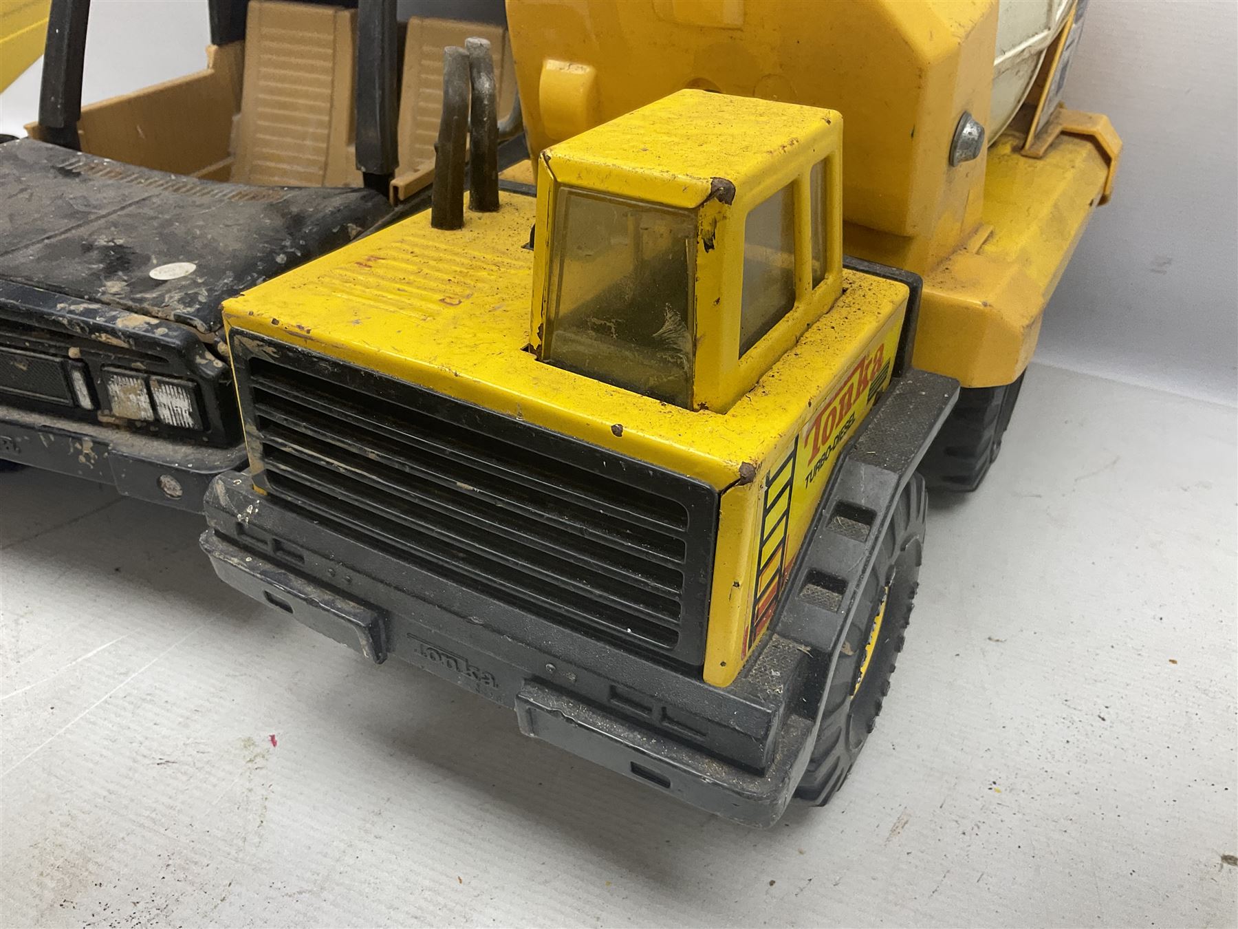 Tonka - five large scale pressed steel vehicles comprising Cement Mixer, Mighty Mobile Crane, Jeep and two Dumper Trucks (5)