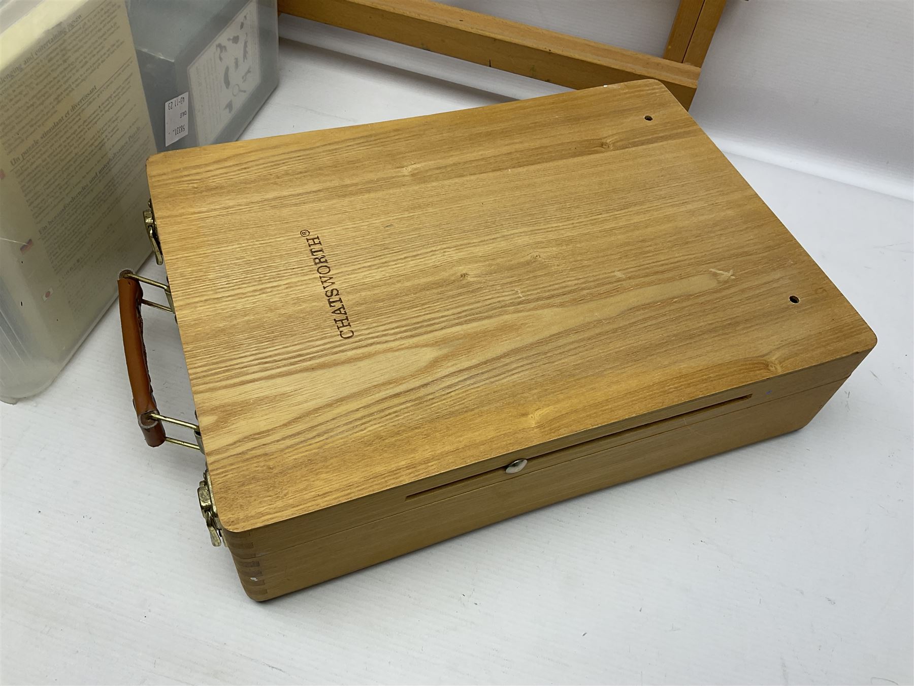 Chatsworth box easel, together with a Reeves table easel, collection of Wentworth jigsaw puzzles and two picnic baskets