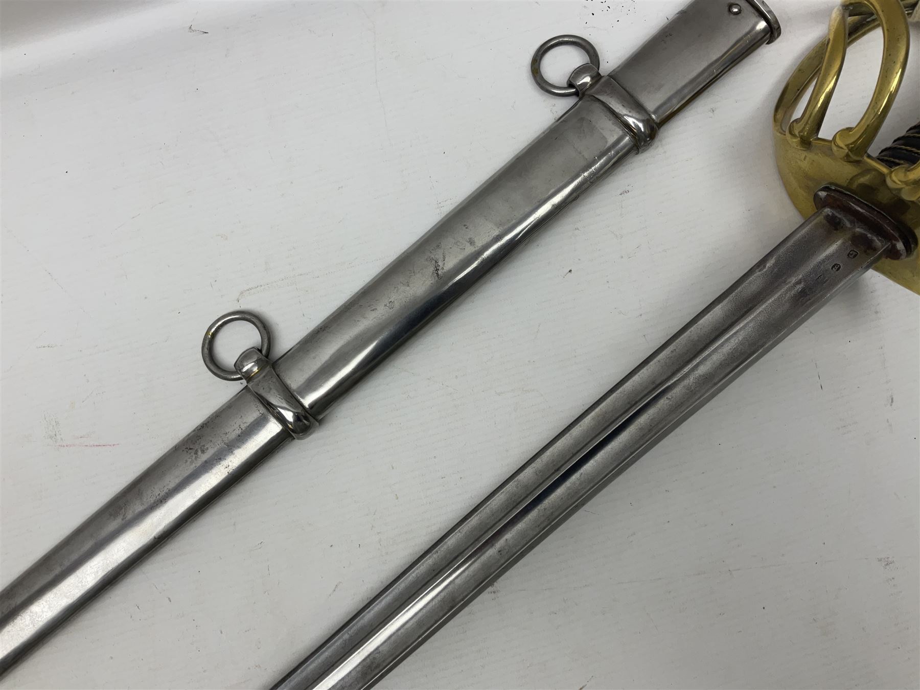 Early 19c French 1st Empire Heavy Cavalry trooper's sword, the 95.5cm double fullered blade with various stamped marks and inscribed Klingenthal 1814 to the back edge, four-bar brass hilt with wire-bound leather grip, knucklebow numbered 139; in polished steel scabbard with two suspension rings L117cm overall