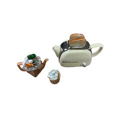 Collection of novelty teapots, together with two honey pots 