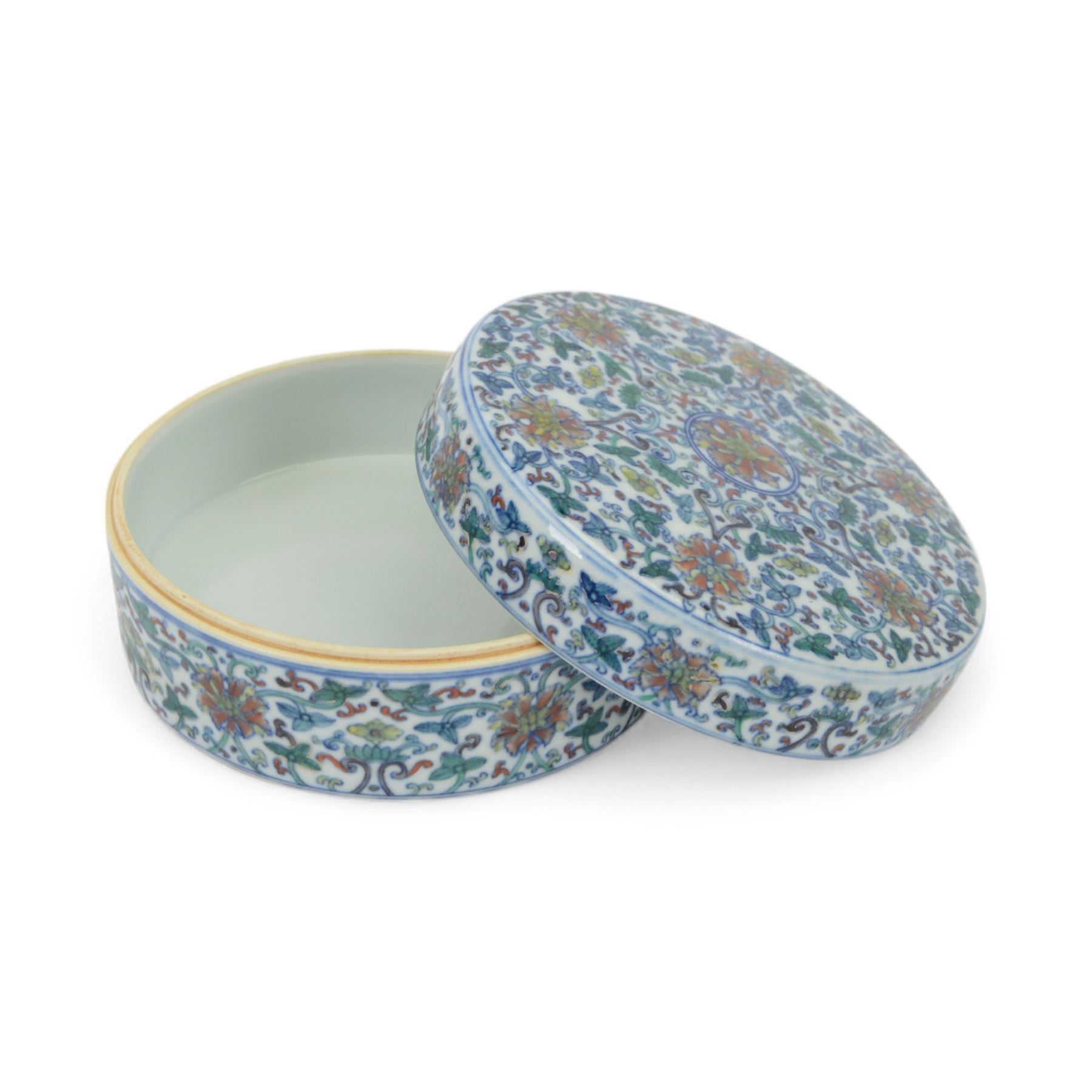 20th century Chinese Doucai box, of circular form, decorated in polychrome enamels with flowers and foliage, with character marks beneath, D18cm, H9cm