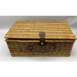 Melamine picnic hamper by Euro-Mel, the tableware decorated with yellow flowers and the wicker basket with green tartan lining