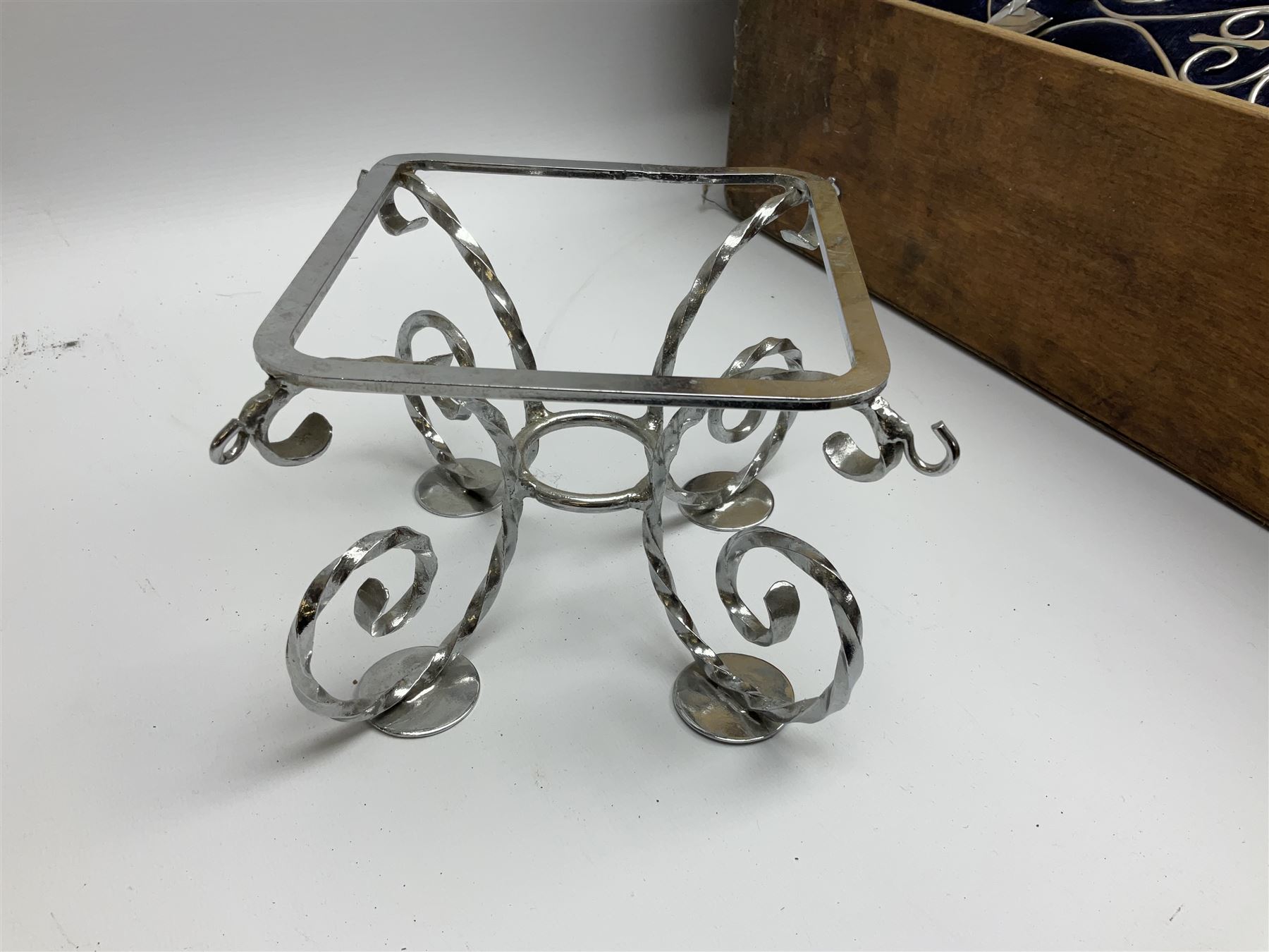 Edwardian wedding cake stand, the blue velvet cushion applied with wirework scroll, in wood box, 56cm X 56CM