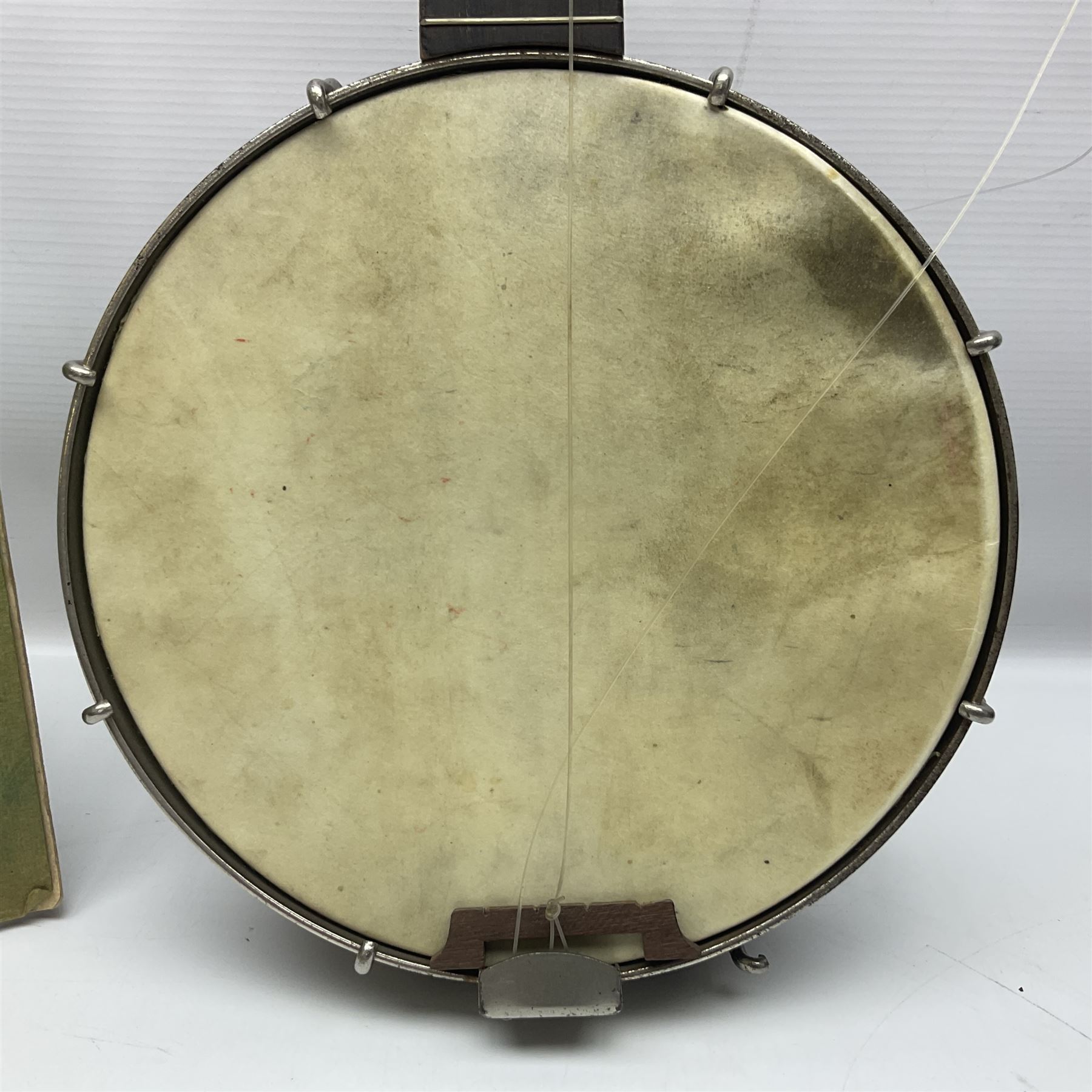 George Formby banjolele with metal plaque to headstock L55cm; in carrying case with instruction booklet.