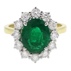 18ct gold oval emerald and round brilliant cut diamond cluster ring, hallmarked, emerald approx 2.35 carat, total diamond weight approx 0.75 carat