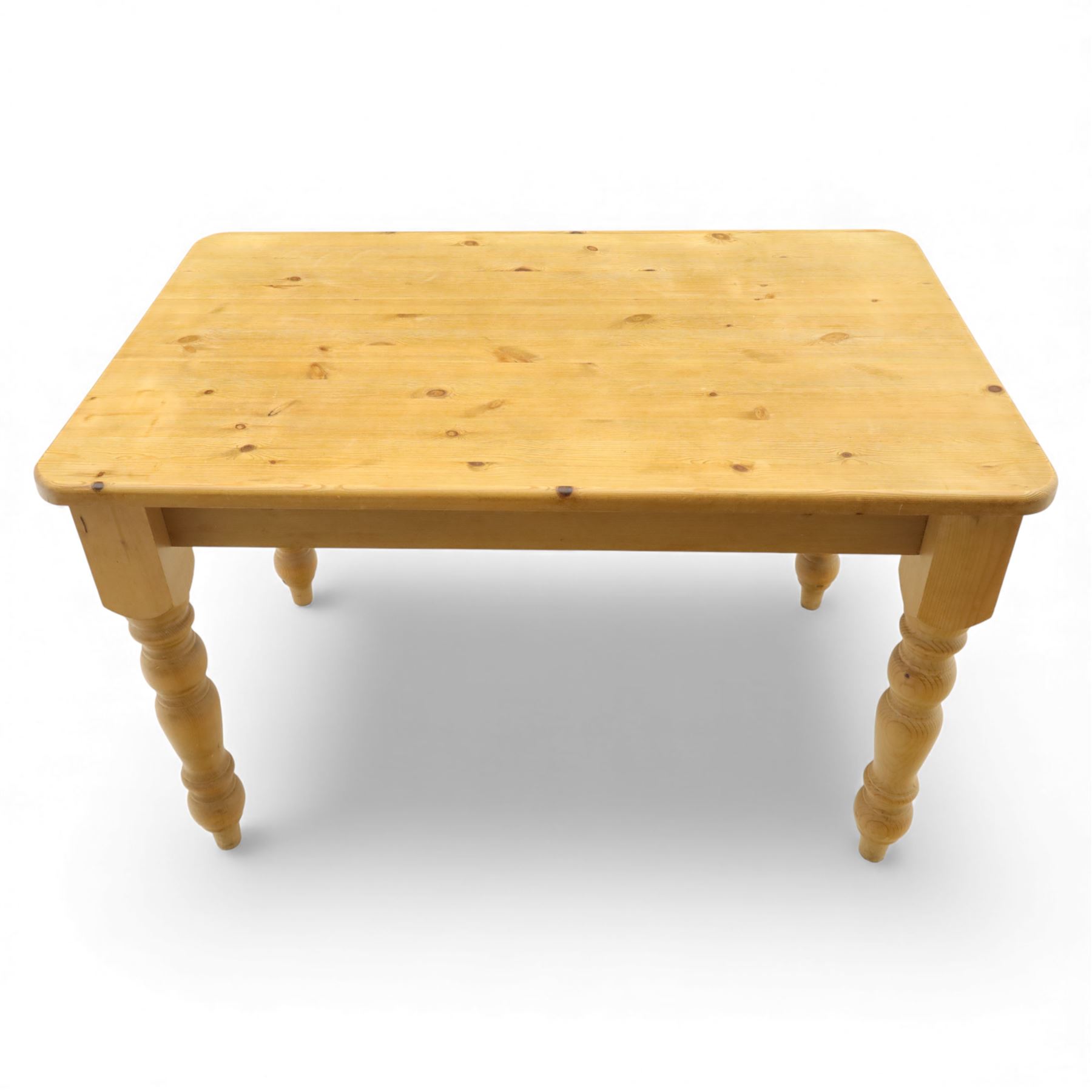 Late 20th century pine farmhouse dining table, rectangular top raised on turned legs, together with a set of matching spindle-back chairs with padded seats