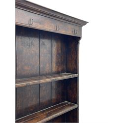 Bylaws of Leominster - 18th century design figured oak dog kennel dresser, the raised plate rack with projecting cornice over hooks and three tiers, moulded rectangular top over three drawers and two panelled cupboards, moulded frame and panelled sides, on stile supports