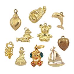 Ten 9ct gold pendant /charms including sailing boat, clown, scorpion, money bag, hearts, teddy bear and witch on broomstick
