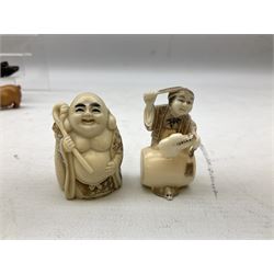 Group of ten Japanese netsukes, comprising eight carved wooden examples, and two ivorine examples, of various form, examples modelled as pigs, owl, mouse with tortoise upon its back, birds, rabbit, etc. 