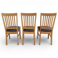 Solid light oak extending dining table with single leaf, and set of six chairs