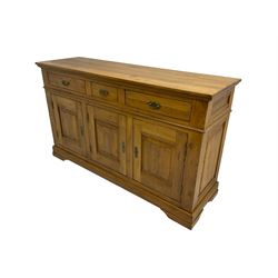 Oak sideboard, fitted with three drawers and three cupboards, enclosed by panelled doors, on bracket feet