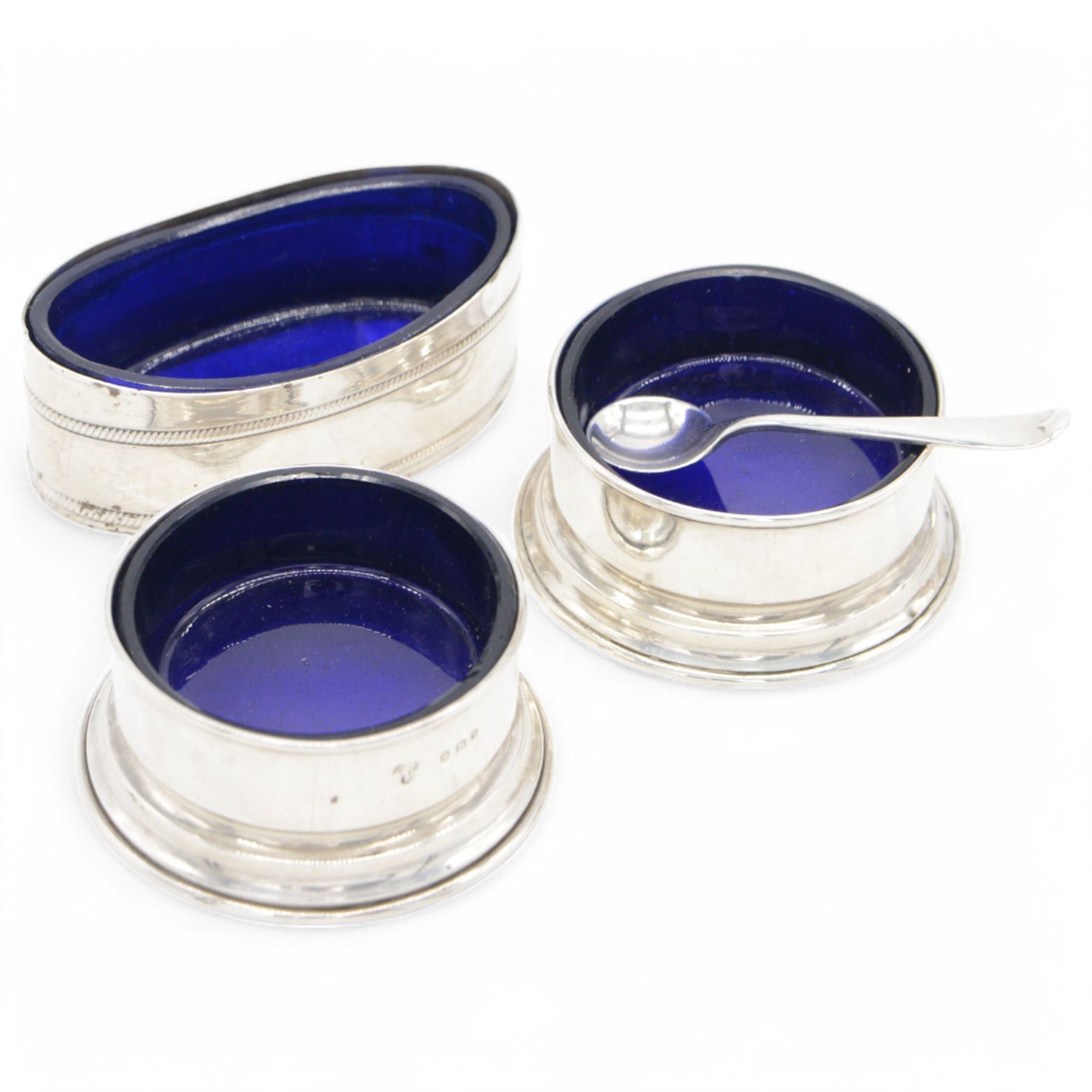 Group of silver cruet items, comprising pair of Art Deco salt and pepper shakers, of tapering cylindrical form, hallmarked Viner's Ltd, Sheffield 1933, pair of silver open salts, pair of salt shaker, and a matching pepper shaker and open salt, all hallmarked