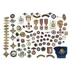 Collection of St John Ambulance enamel and metal badges, together with Red Cross medals and badges