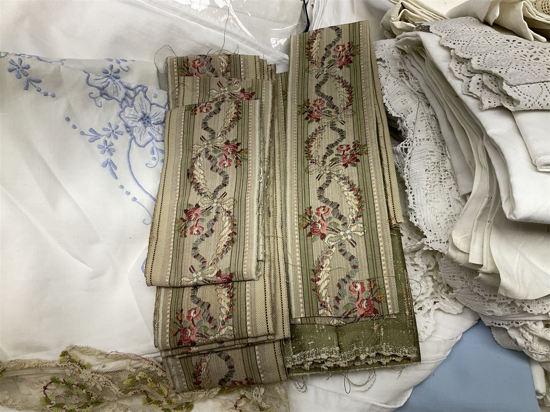 Large quantity of table linen and Victorian and later lace, framed machine tapestry depicting Greece, embroidered wall hanging decorated with a woodland scene with deer and blossoming tree, embroidered linen decorated with floral design, crochet, etc