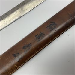 WW2 Japanese Army officer's shin gunto/katana sword with 67cm steel single edged blade, foliate cast brass tsuba, bound fish-skin grip with brass mounts, inscribed and painted marks to tang; in lacquered wooden scabbard with leather combat covering bearing four character marks L99cm overall