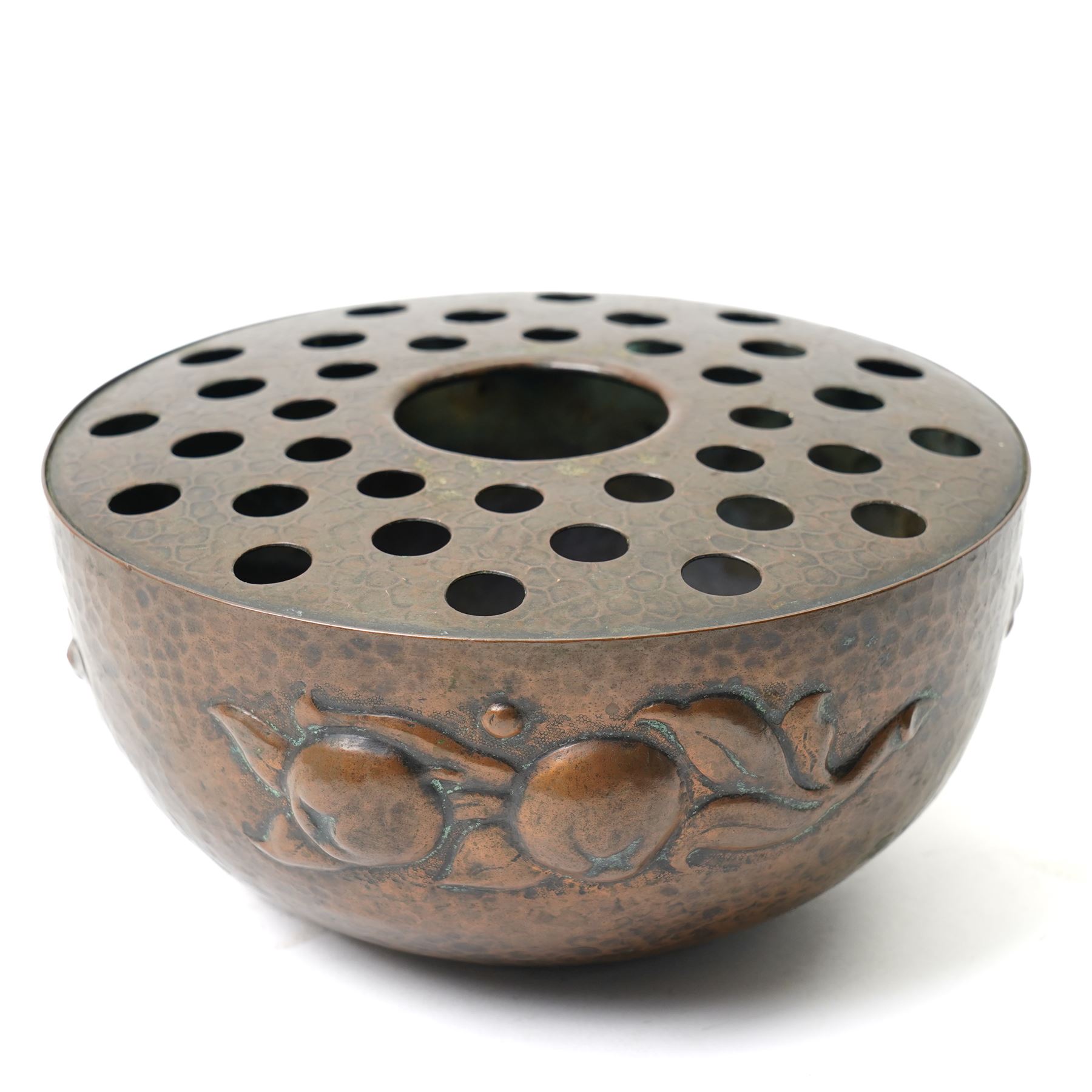 Newlyn school Arts and Crafts copper rose bowl, the planished exterior with fruit and leaves in high relief, H8.5cm x W18cm