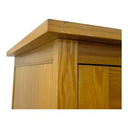 Light oak wardrobe, adjustable clothes rail and single shelf above a single drawer on squared splayed legs
