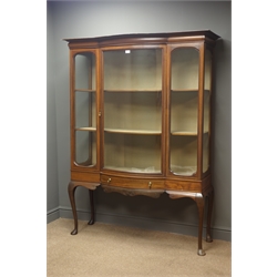  Edwardian inlaid mahogany display cabinet, projecting cornice, glazed bow front door enclosing three shelves, single drawer to carved apron, cabriole supports, W122cm, H177cm, D45cm  
