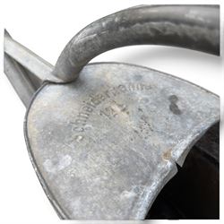 Assorted garden and architectural salvage, comprising a galvanised watering can, two long-handled cutting tools, metal pole, pair of ornate cast iron supports and further decorative fragments