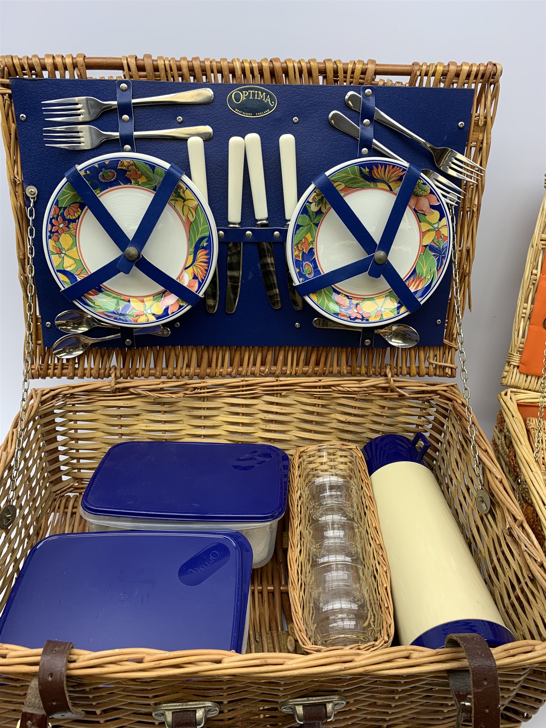 Two wicker picnic baskets, the largest by Optima and fitted for four