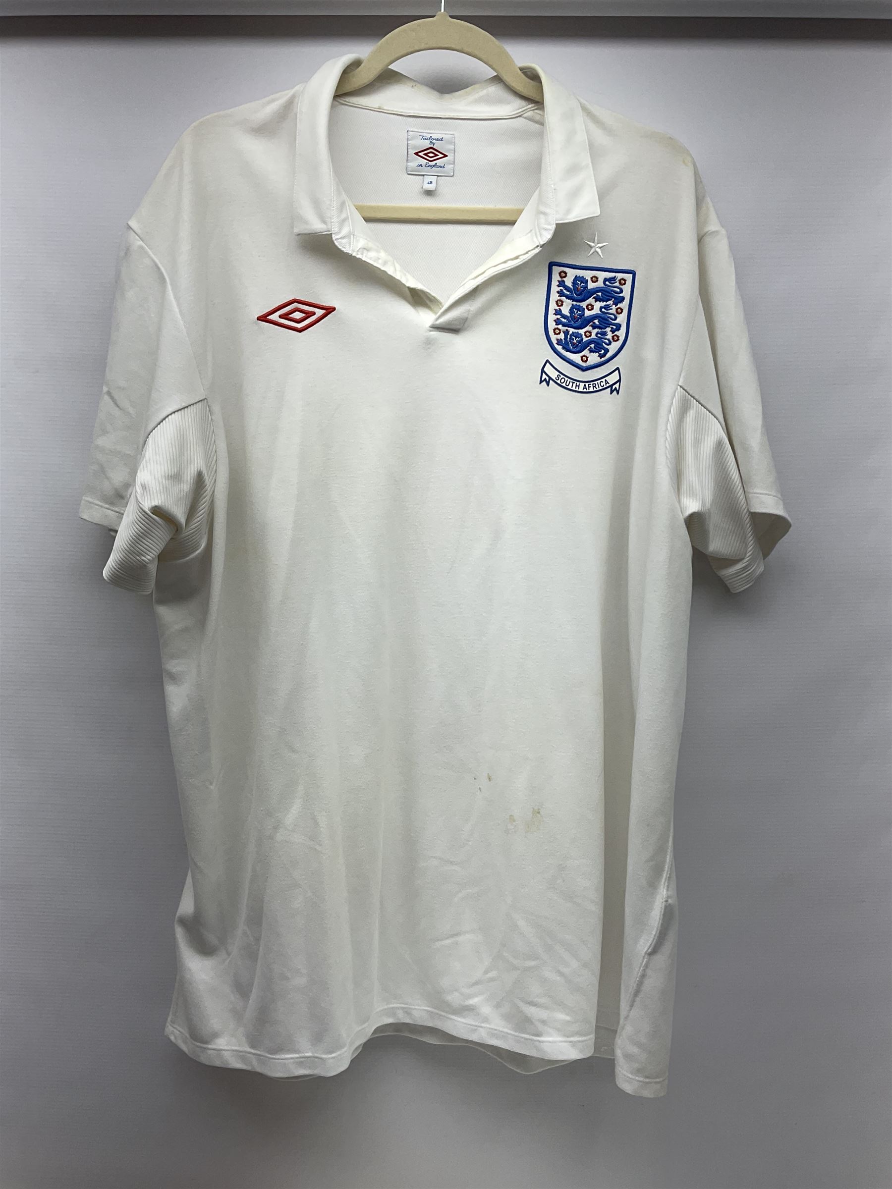 Fourteen items of replica sporting clothing including Leeds United football club shirts, England jerseys etc