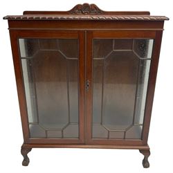 20th century mahogany display cabinet, shell carved pediment over gadrooned top, enclosed by two glazed doors, on ball and claw carved cabriole feet