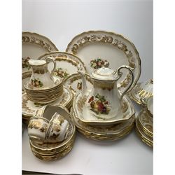 Extensive Spode dinner and tea service, decorated in the Golden Valley pattern, comprising eighteen dinner plates, ten salad plates, ten side plates, ten twin handled soup bowls and ten saucers, ten bowls, two sauce boats and two stands, two square serving dishes, smaller oval serving dish, two tureens and covers, two large oval serving platters, one smaller example, teapot, coffee pot, milk jug, twin handled lidded sucrier, and ten teacups and ten saucers, with red printed marks beneath 