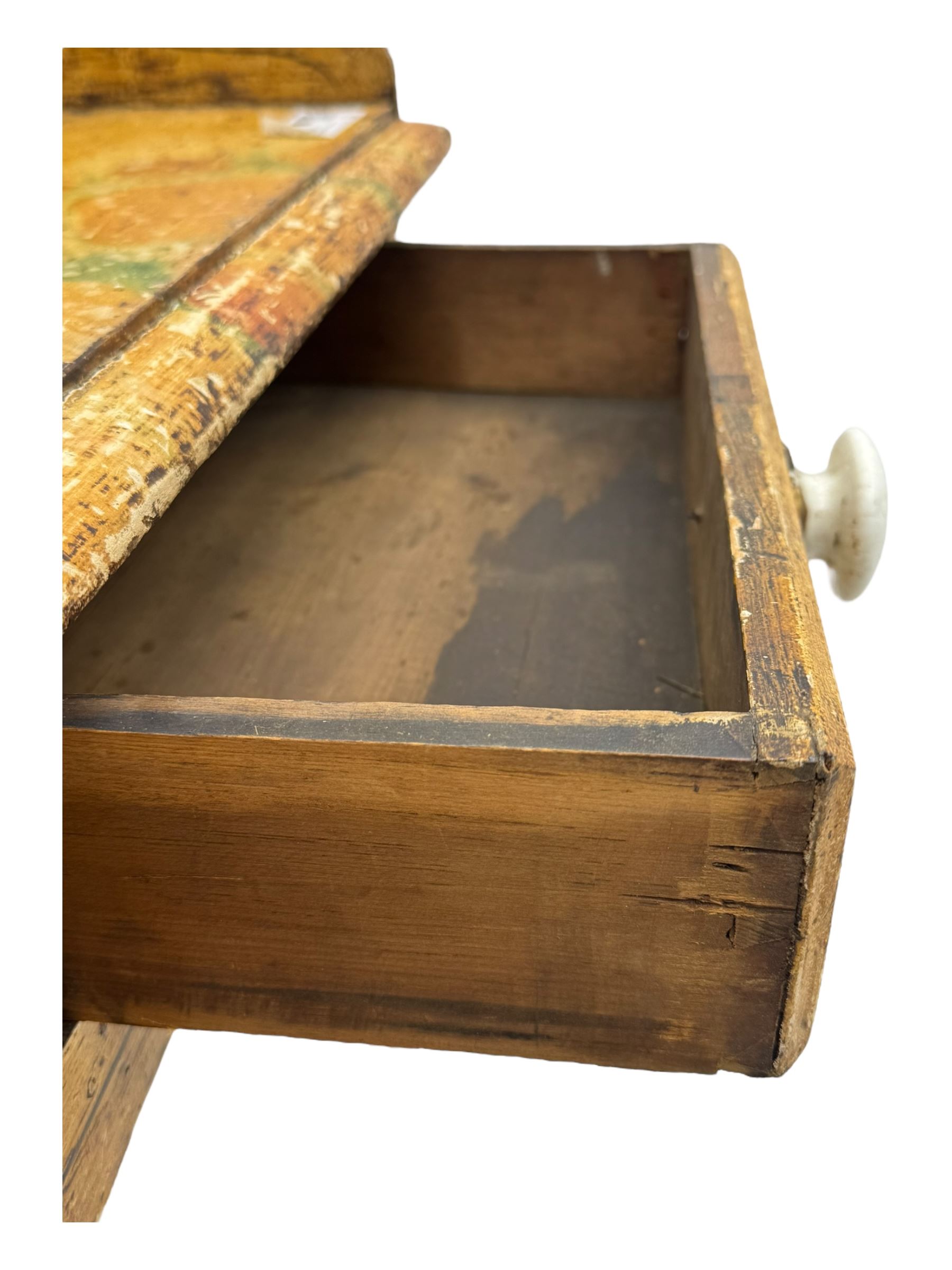 Victorian scumbled pine dressing table, rectangular top with shaped and scrolled gallery back, fitted with two drawers with ceramic knobs, on turned supports