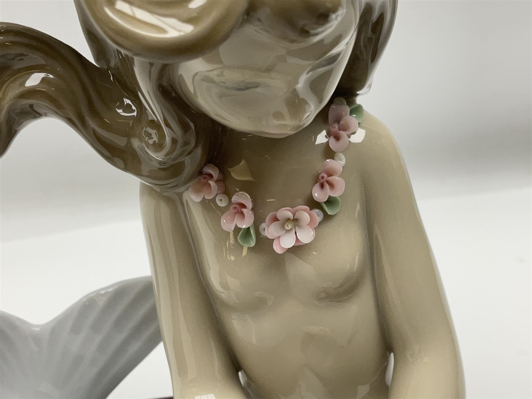 Lladro Mermaid trio set, comprising Illusion no. 1413, Fantasy no.1414 and Mirage no. 1415, all with wooden bases, largest H20cm