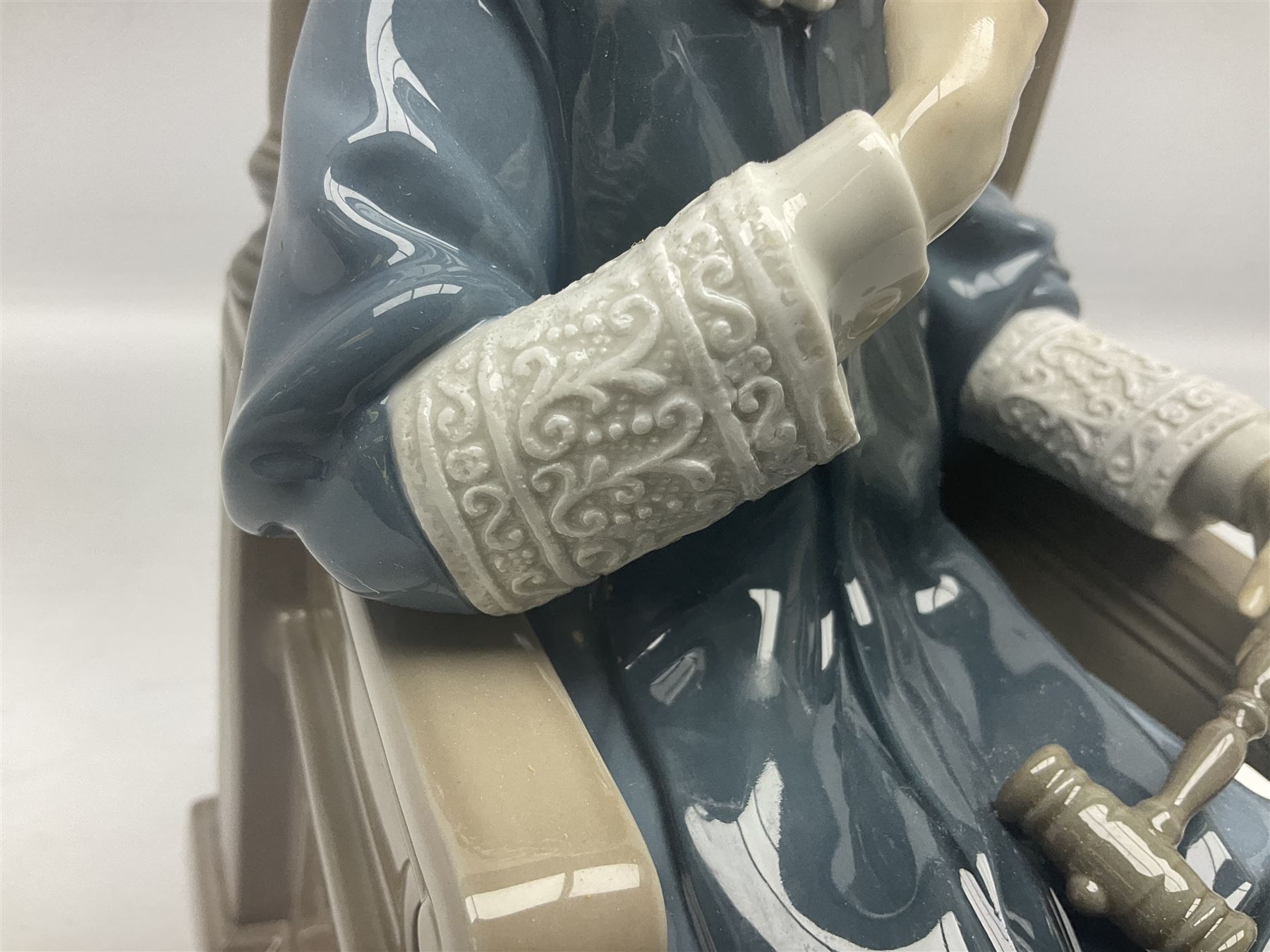 Lladro figure, Justice, modelled as a judge sat in a char, sculpted by Salvador Furió, with original box, no 5489, year issued 1988, year retired 1993, H34cm 