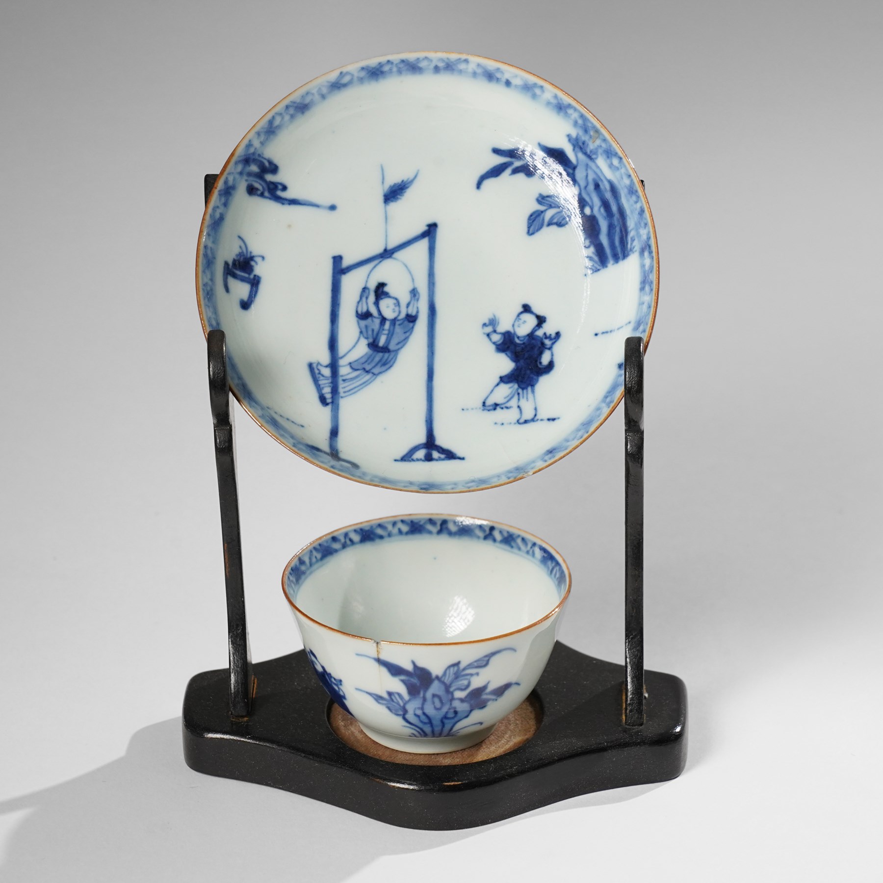 Collection of 18th century blue and white Chinese tea wares, comprising girl on swing saucer and tea bowl, boy riding buffalo tea bowl, one wine cup with foliate rim with Artemisia leaf mark to base, and similar with lotus mark to base, miniature vase, small teabowl with six character reign mark possibly Chenghua, Daoguang saucer, and others, mostly unmarked (13)