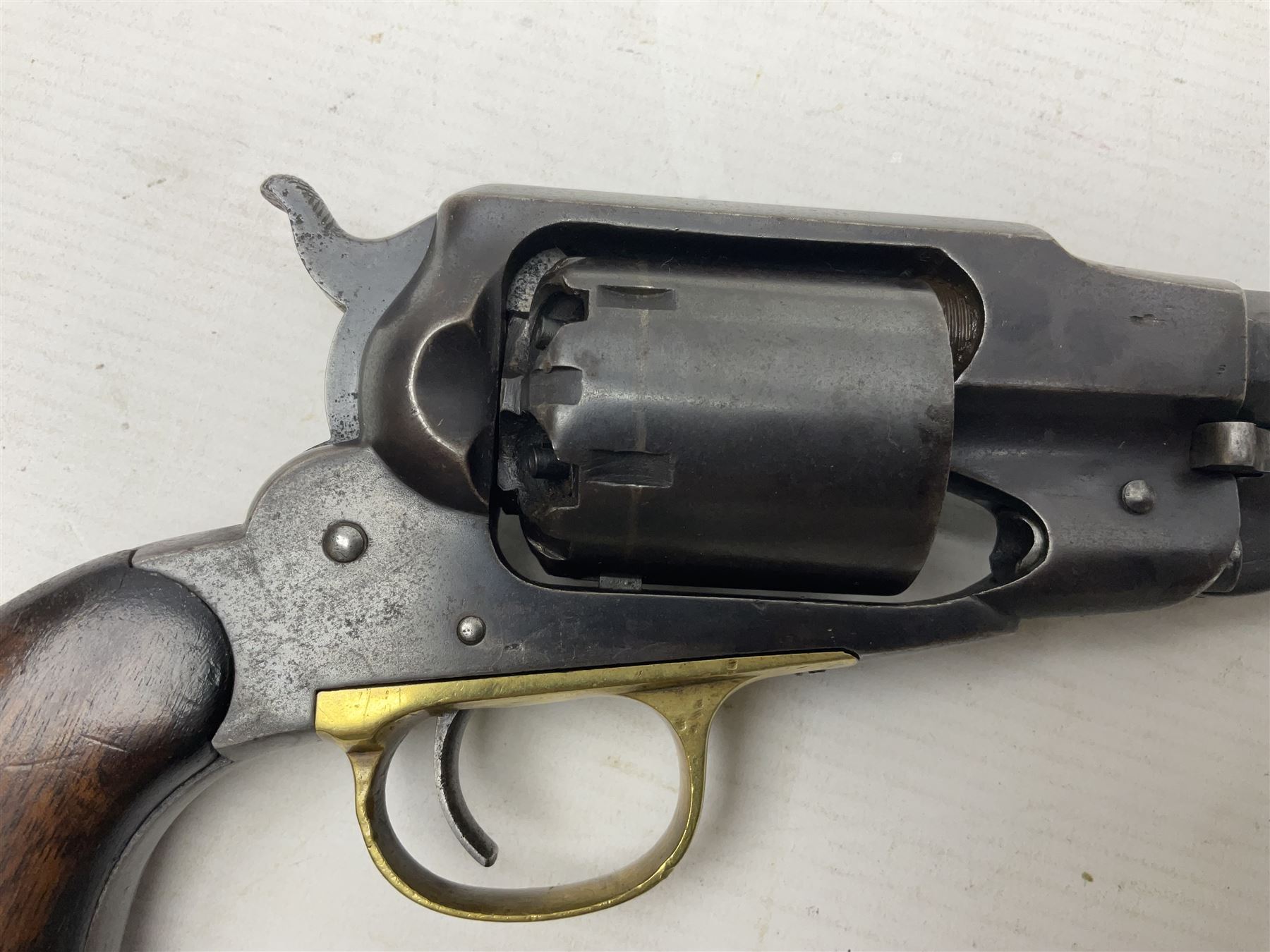 Unmarked Spencer & Rogers type Remington style .44 cal. six-shot percussion revolver, 20cm octagonal barrel with loading lever under, brass trigger guard and two-piece wooden grip L37cm overall; together with a framed watercolour by Alan J. Gray dated 2009 entitled 'The Remington .44 Calibre 1861 Navy Revolver'  19 x 42cm (2)